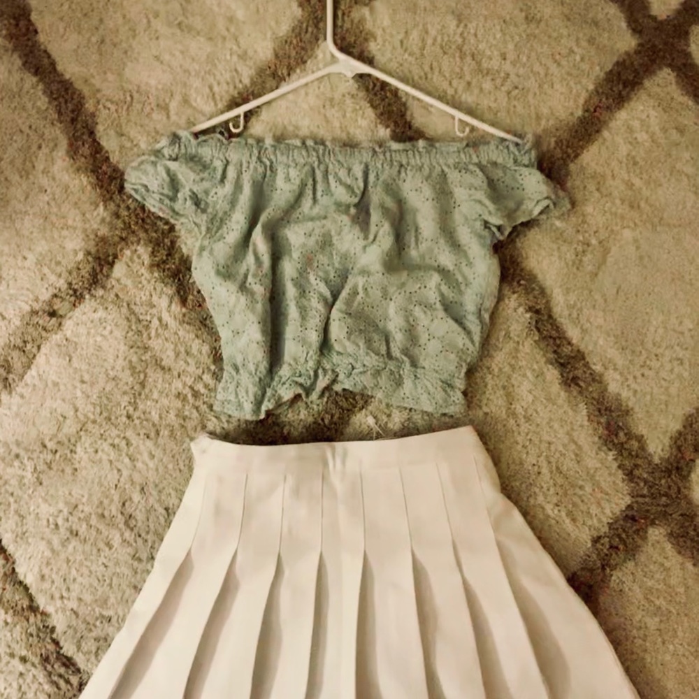 Mint green top with white pleated short skirt